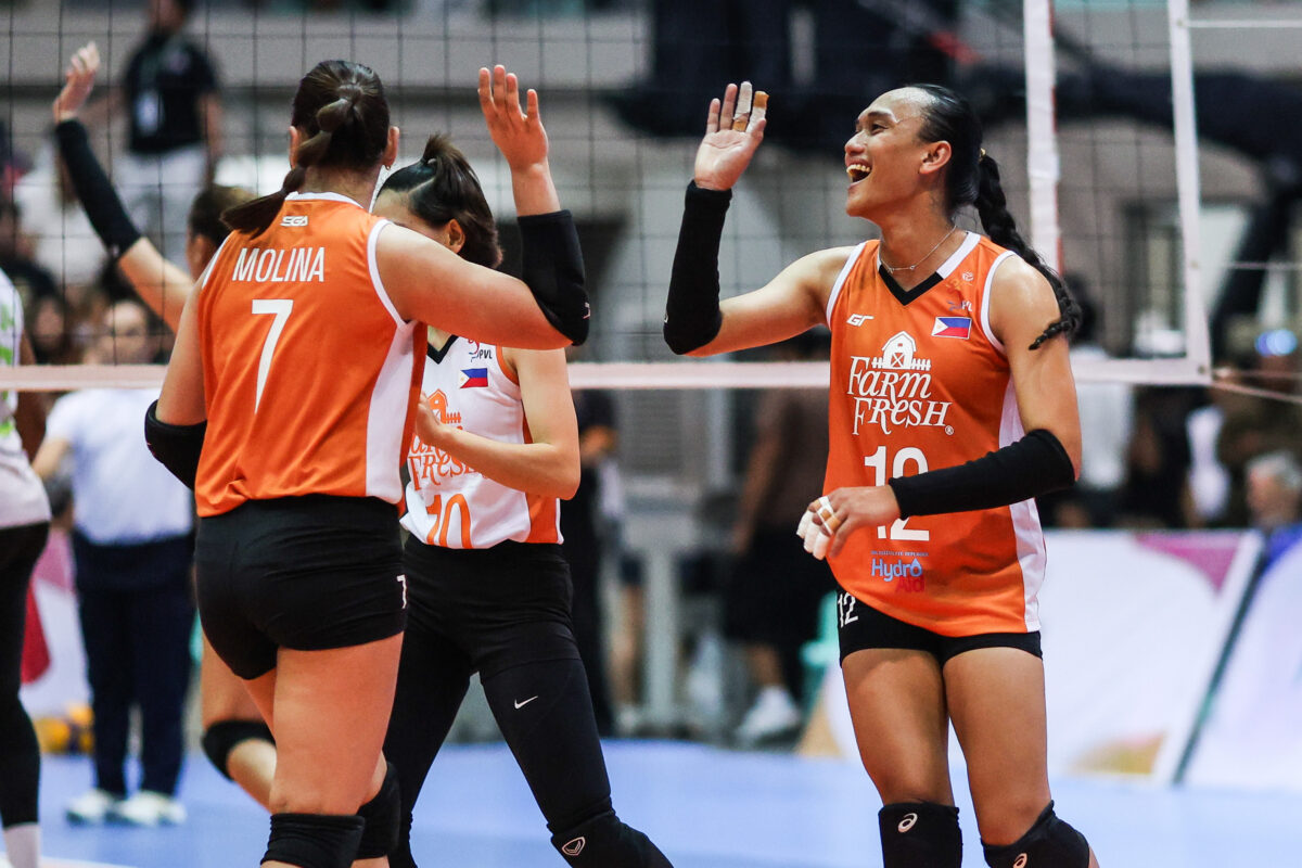 Trisha Tubu (right) and Ces Molina celebrate after leading Farm Fresh to victory.