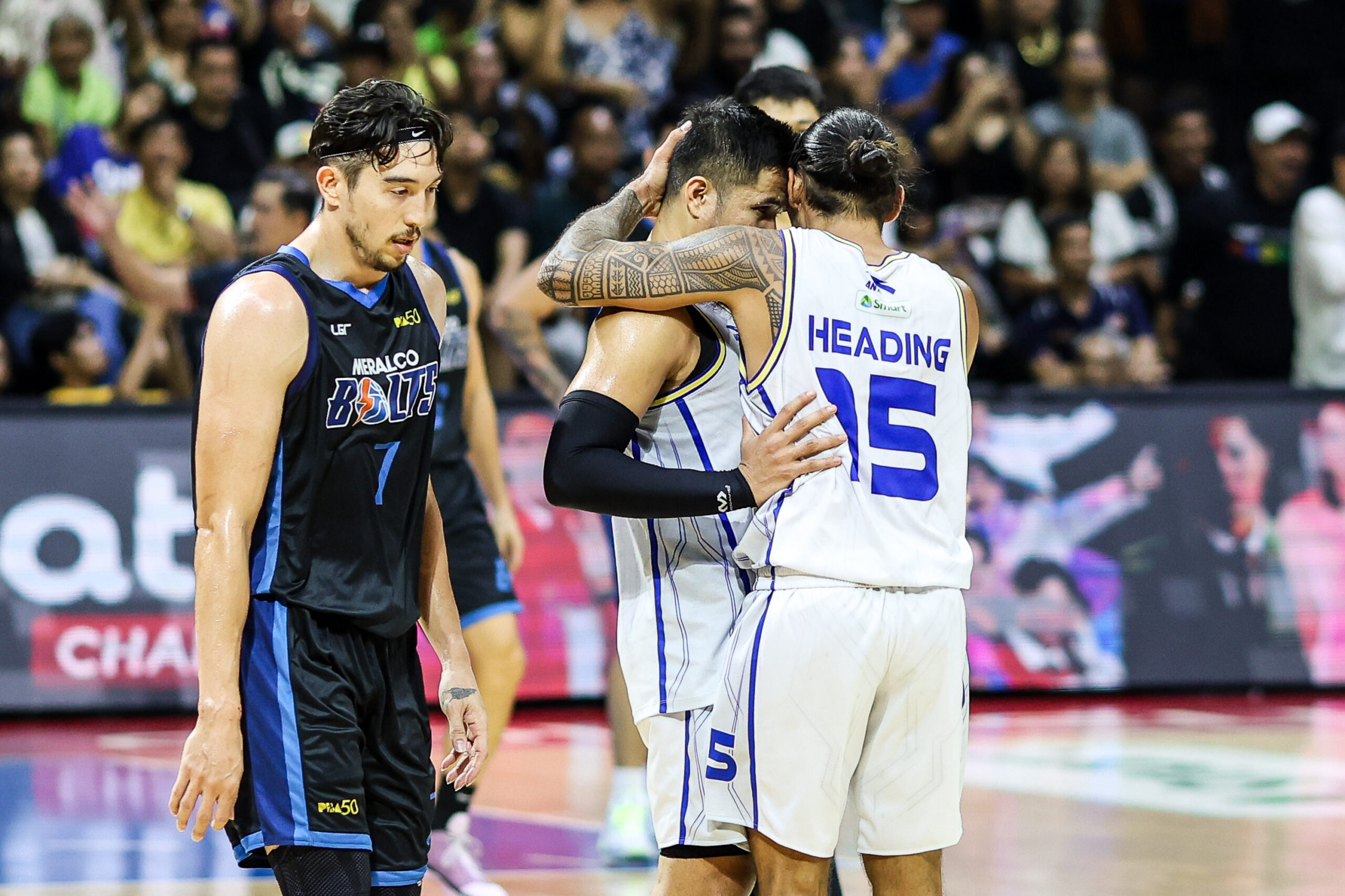 TNT Tropang 5G's Jordan Heading and Roger Pogoy during a game vs Meralco Bolts in the 2026 PBA Commissioner's Cup semifinals.