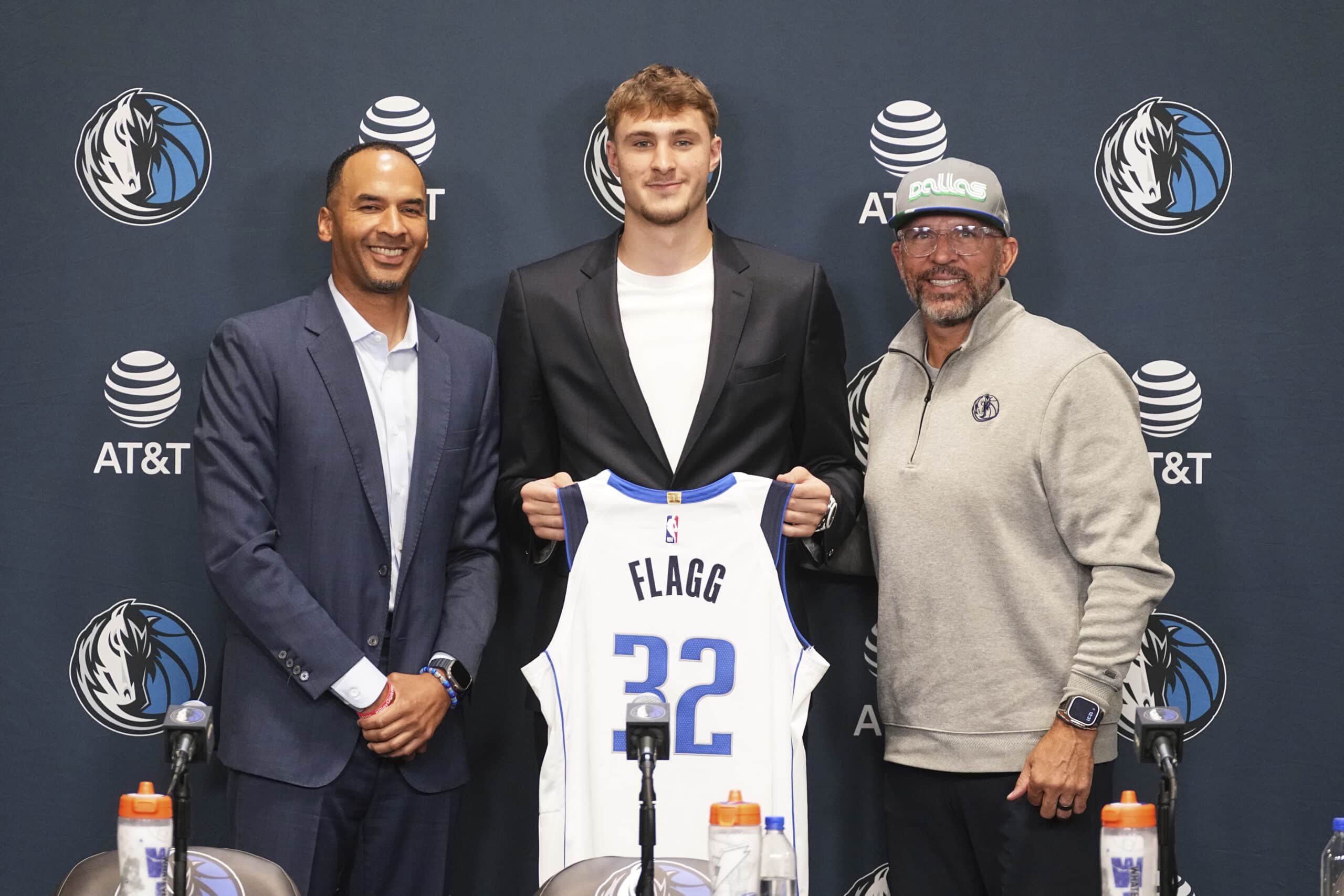 Dallas Mavericks President of Basketball Operations and General Manager Nico Harrison, left, and head coach Jason Kidd, right, pose for photos with the No. 1 overall draft pick Cooper Flagg, center, following an NBA basketball press conference at the team's practice facility Friday, June 27, 2025, in Dallas.