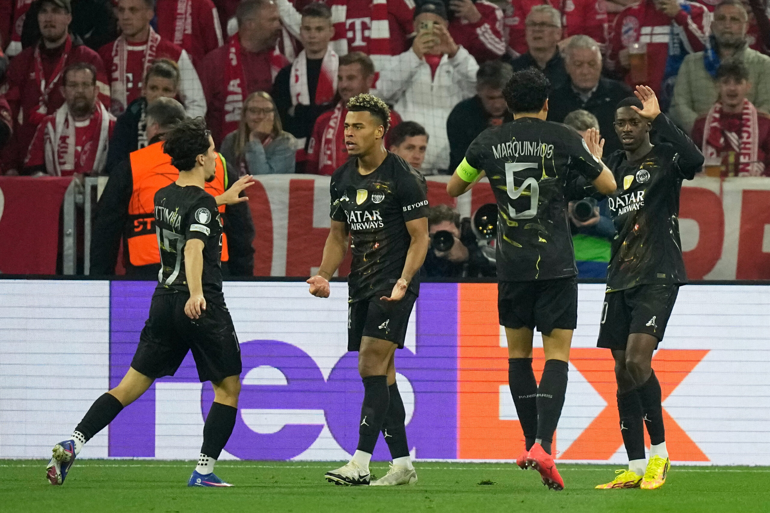 PSG's Ousmane Dembele, right, celebrates with teammates after scoring his sides first goal during the Champions League semifinal second leg soccer match between Bayern Munich and Paris Saint Germain in Munich, Germany, Wednesday, May 6, 2026. 