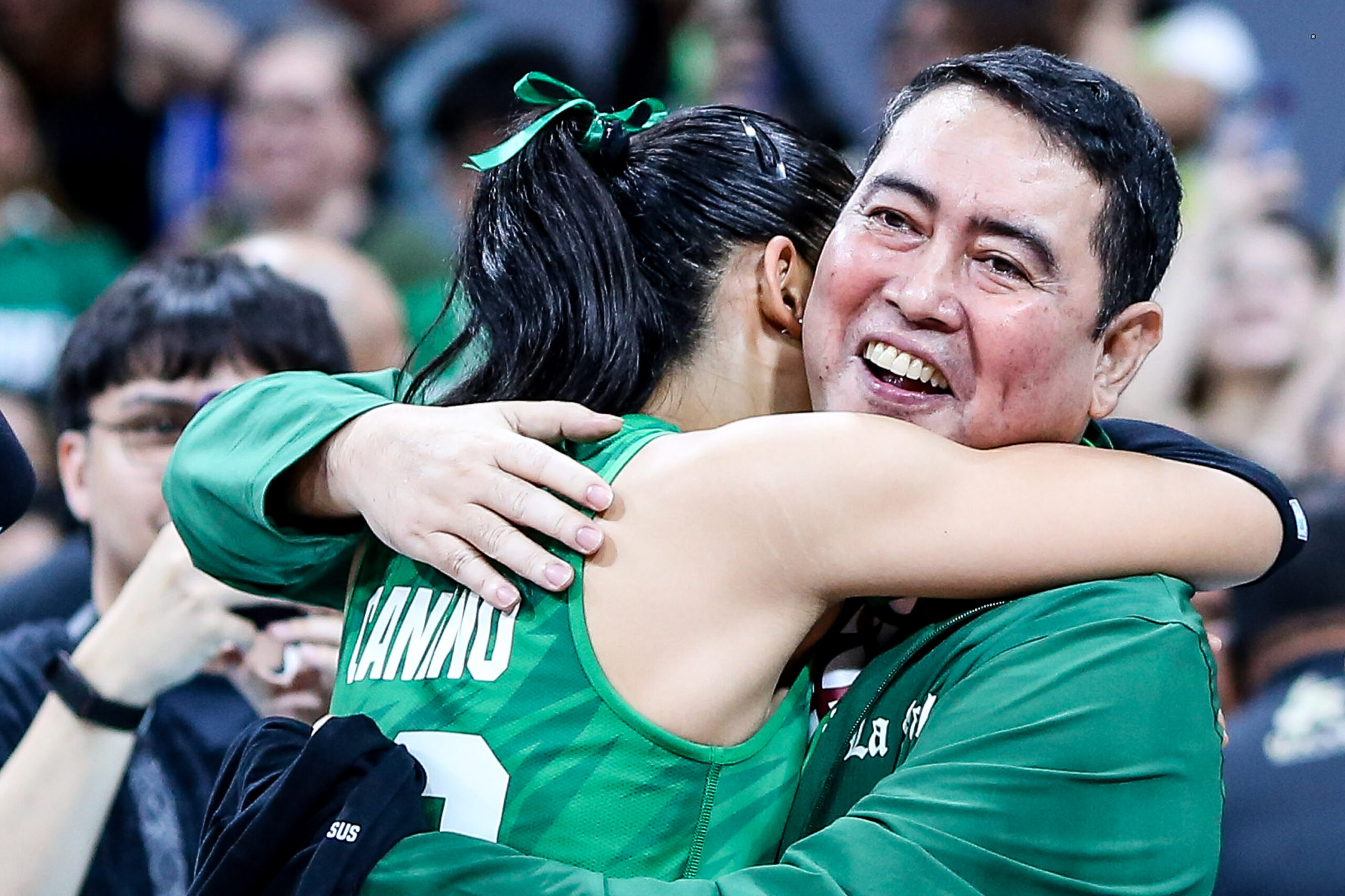 Angel Canino and La Salle Lady Spikers' coach Ramil de Jesus after winning the championship in the UAAP Season 88 women's volleyball tournament.
