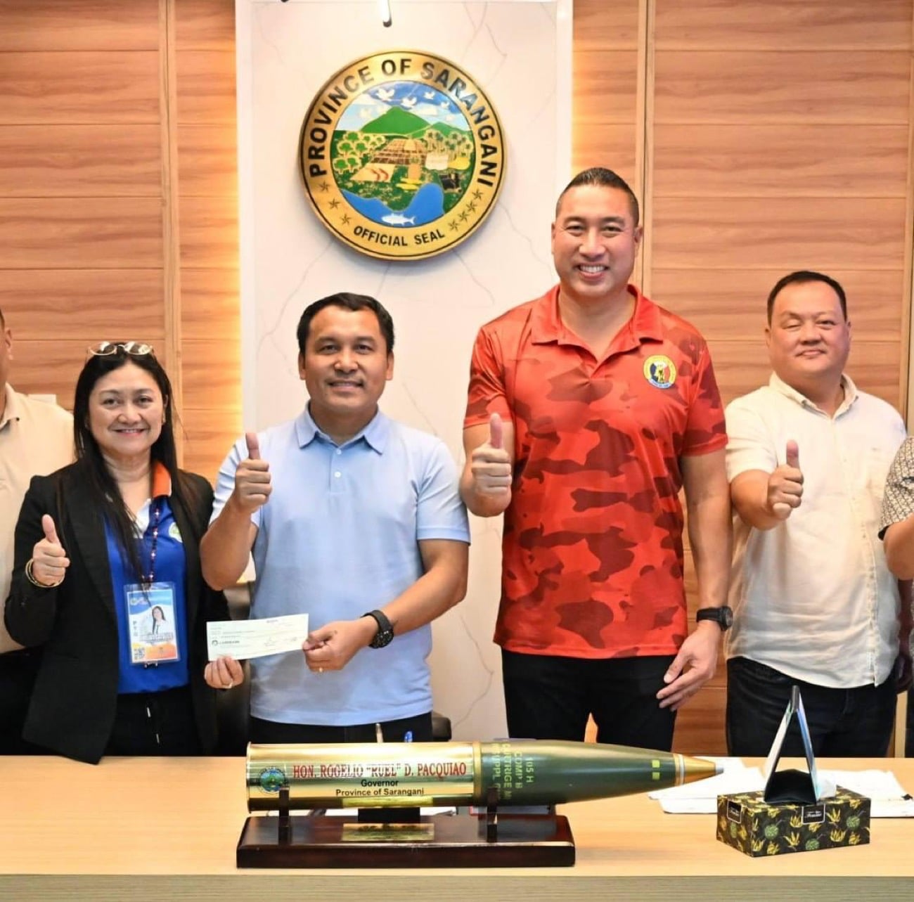 Francis Zamora turns over financial aid to Sarangani