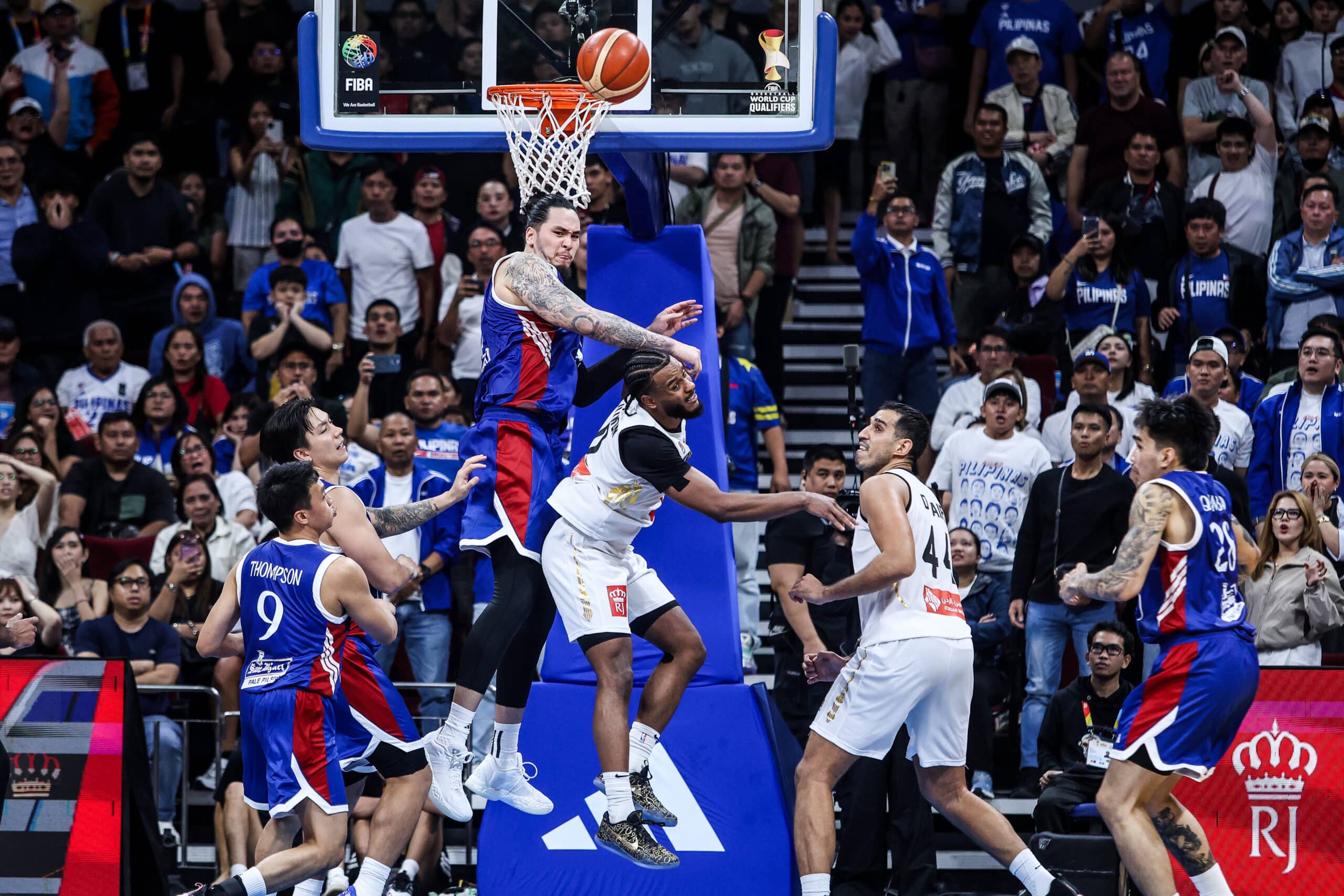 Kai Sotto blocks Abdullah Olajuwon during a game between Gilas Pilipinas and Jordan in the Fiba World Cup 2027 Asian Qualifiers at Mall of Asia Arena