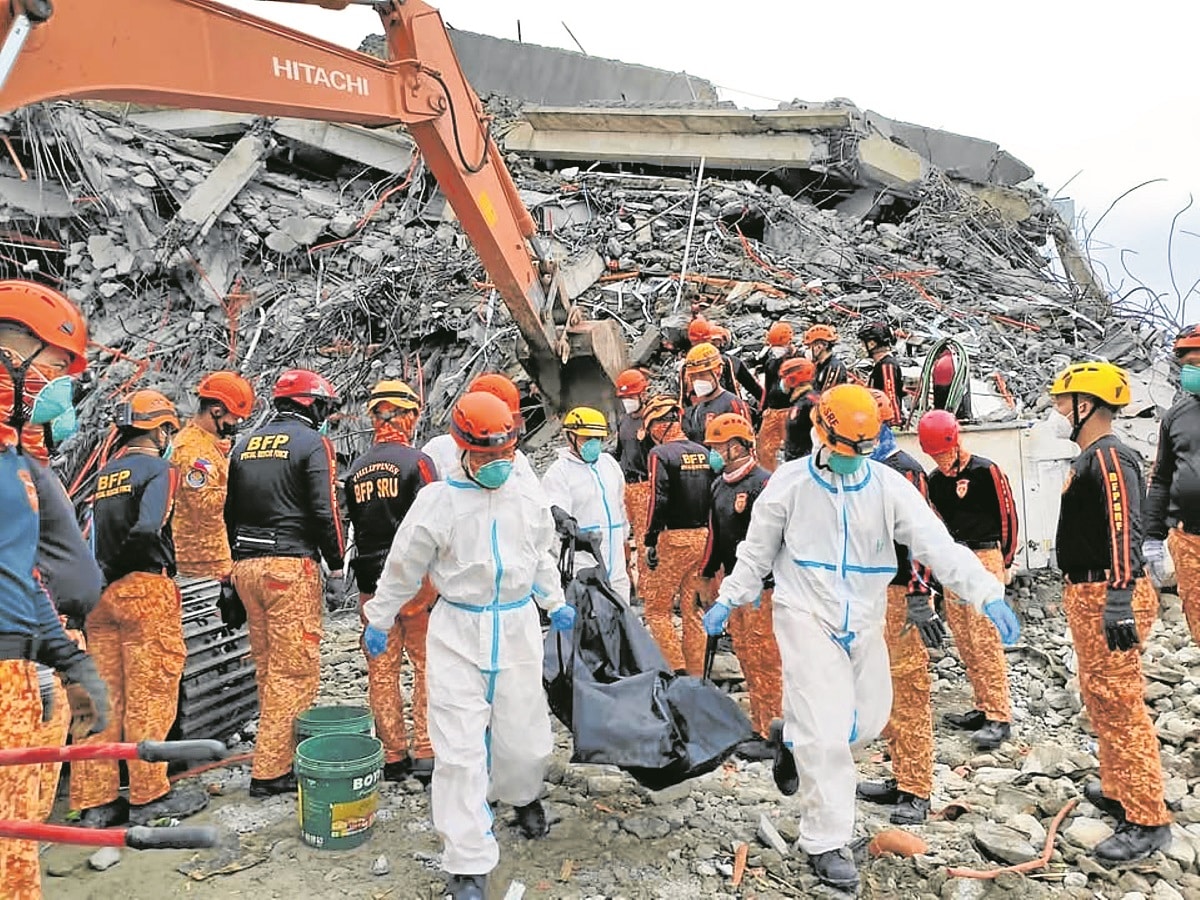 Dead at toppled building now 27