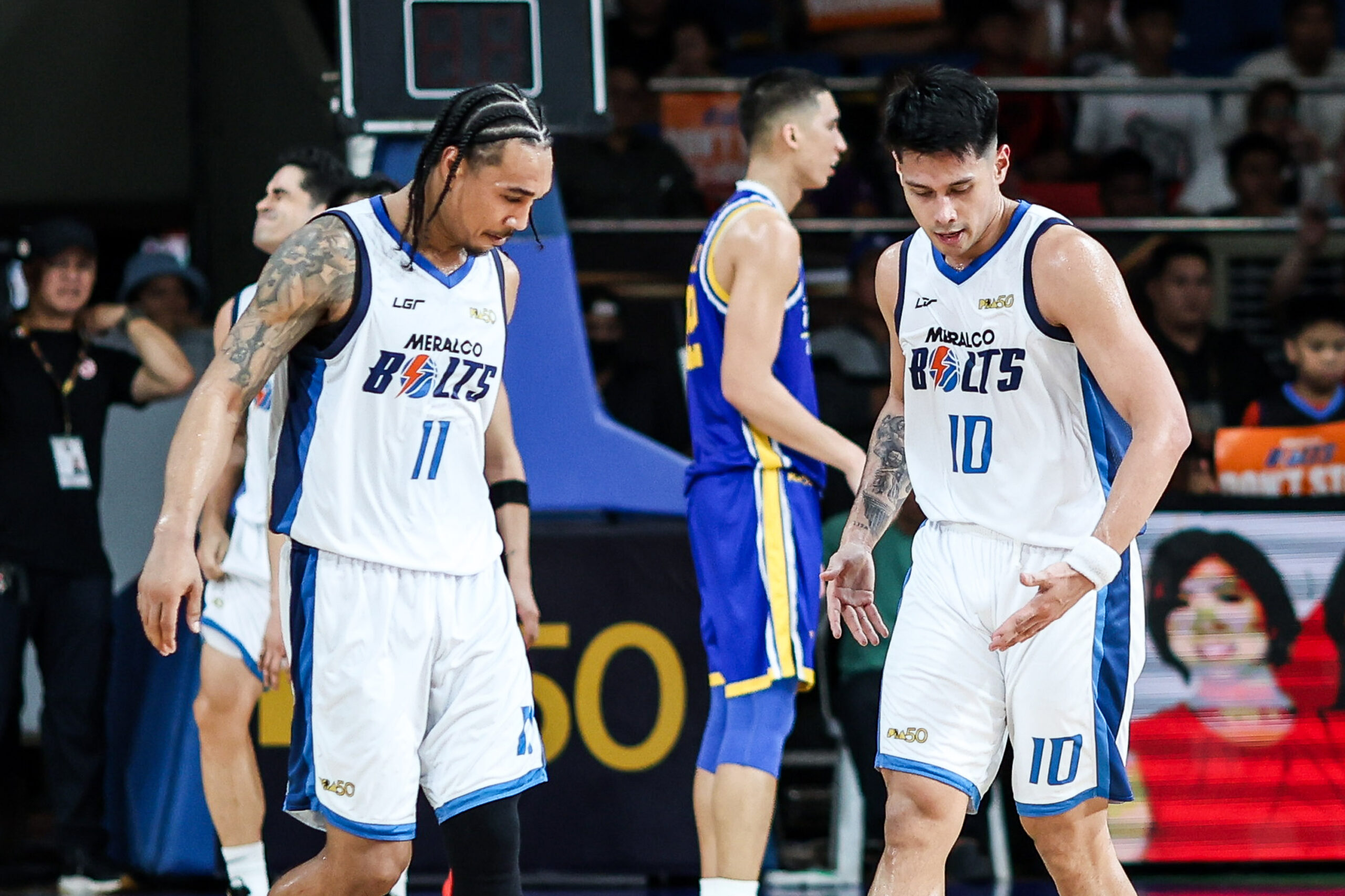Meralco Bolts' Chris Newsome and Javee Mocon during a game against Magnolia Hotshots in the 2026 PBA Commissioner's Cup quarterfinals.