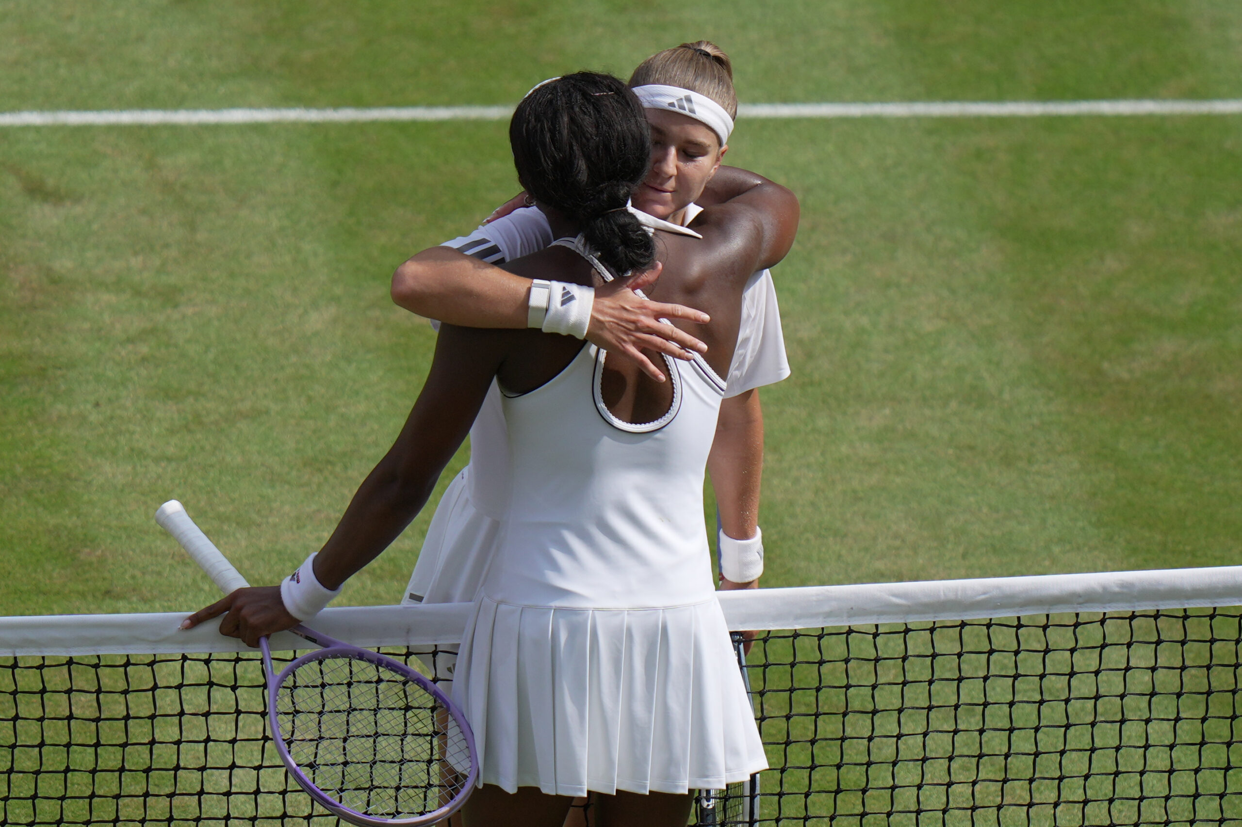 Karolina Muchova of Czech Republic, right, hugs Coco Gauff of the United States after winning their women's singles semifinal match at the Wimbledon Tennis Championships in London, Thursday, July 9, 2026. 