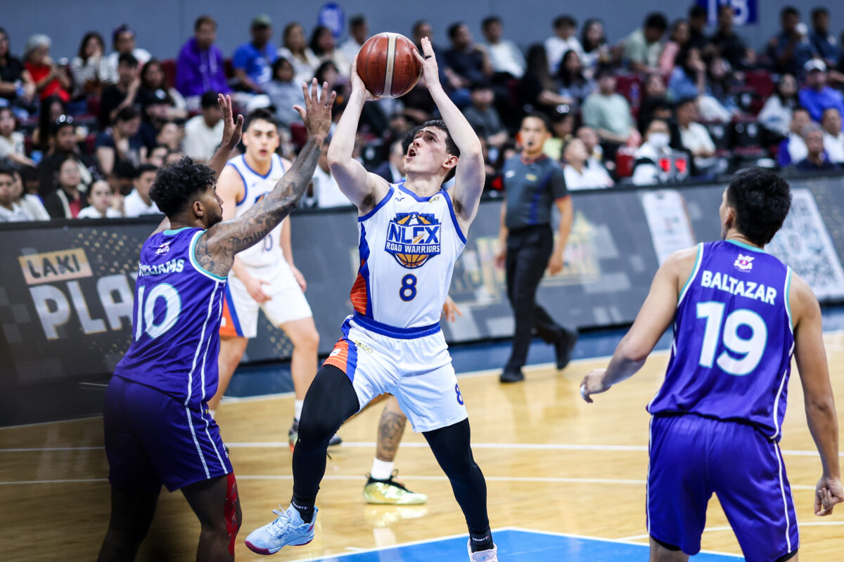 Robert Bolick (No. 8) squares up for a shot.