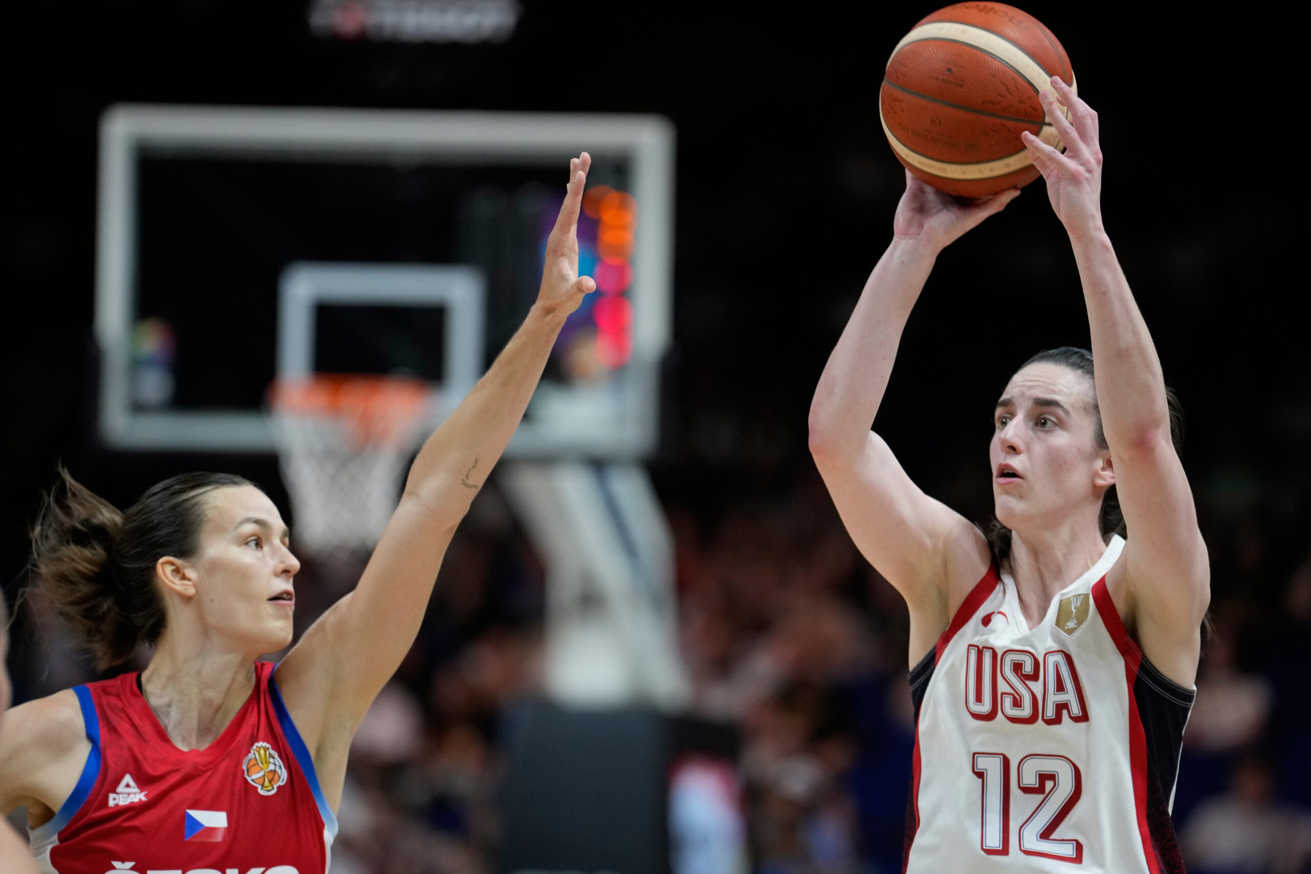 Caitlin Clark, of the United States, shoots over Czechia's Veronika Vorackova during the Women's Basketball World Cup match between the United States and Czechia in Berlin, Monday, Sept. 7, 2026. 