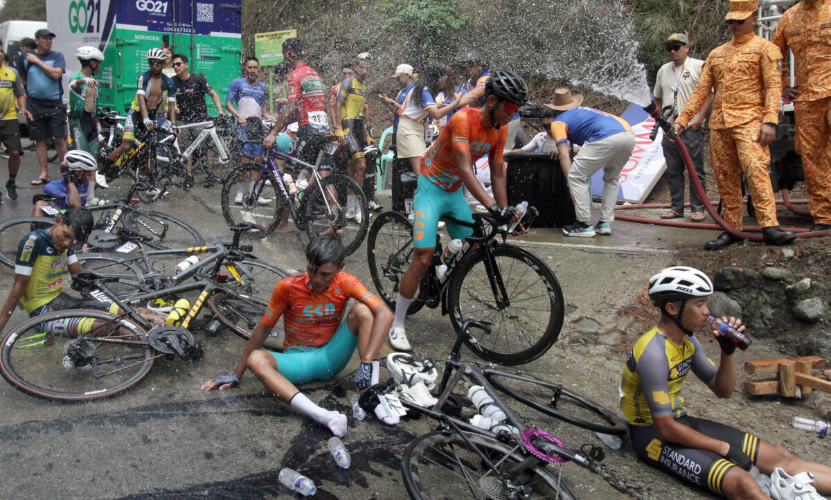 Fatigued cyclists get hosed down at the finish.