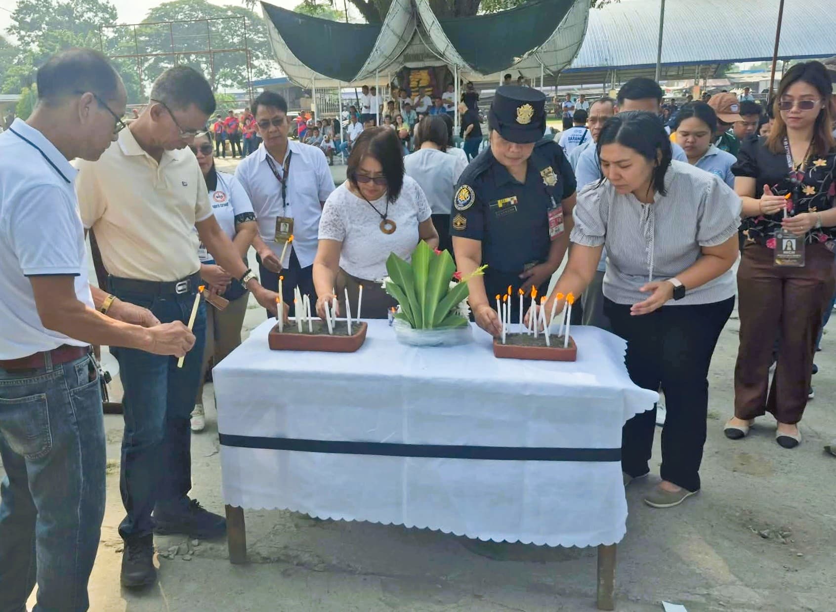 Banga lights candles for school shooting victims