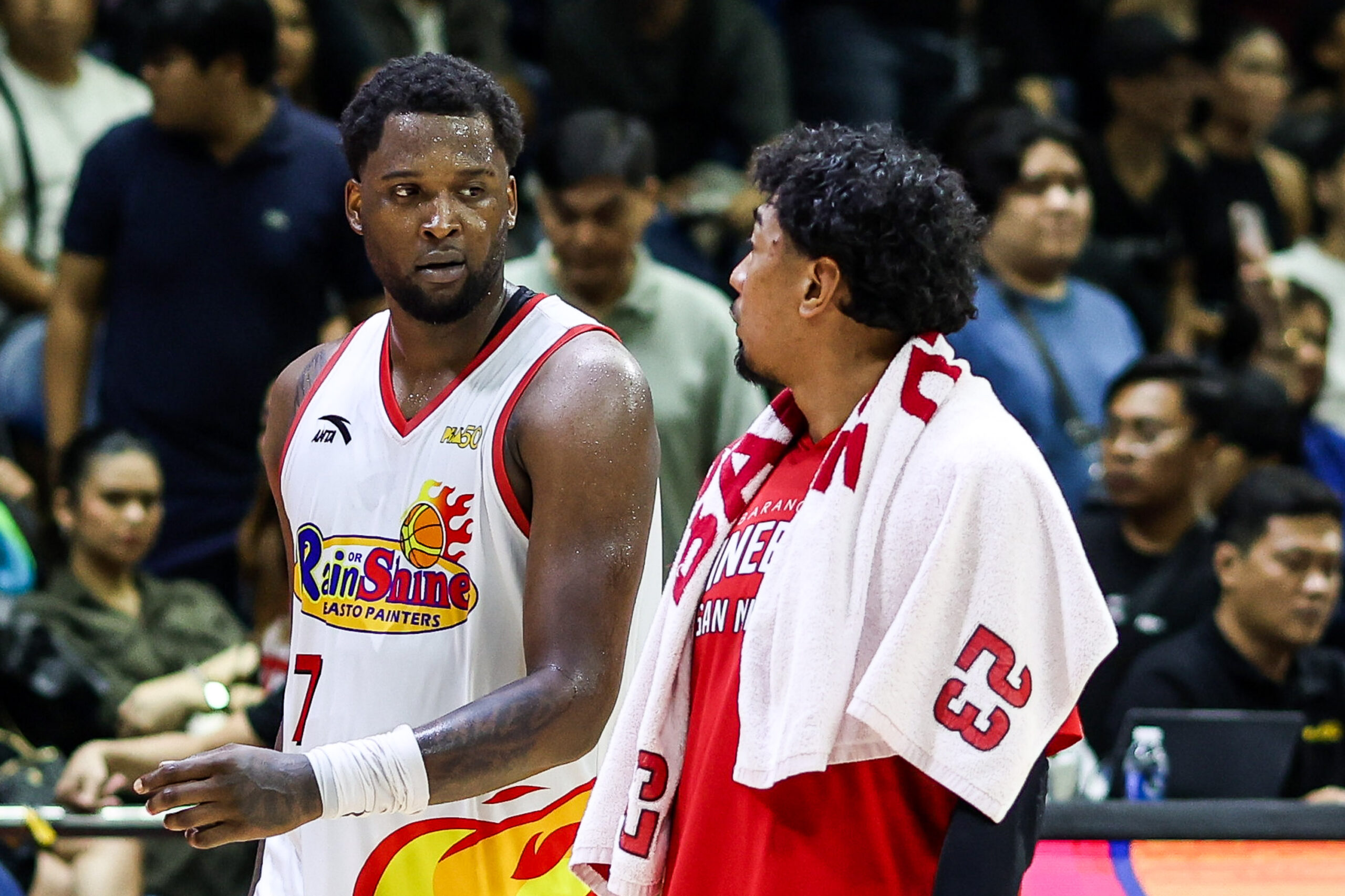 Rain or Shine Elasto Painters' Jaylen Johnson and Barangay Ginebra Gin Kings' Raymond Aguilar exchange some words during Game 5 of the 2026 PBA Commissioner's Cup semifinals.
