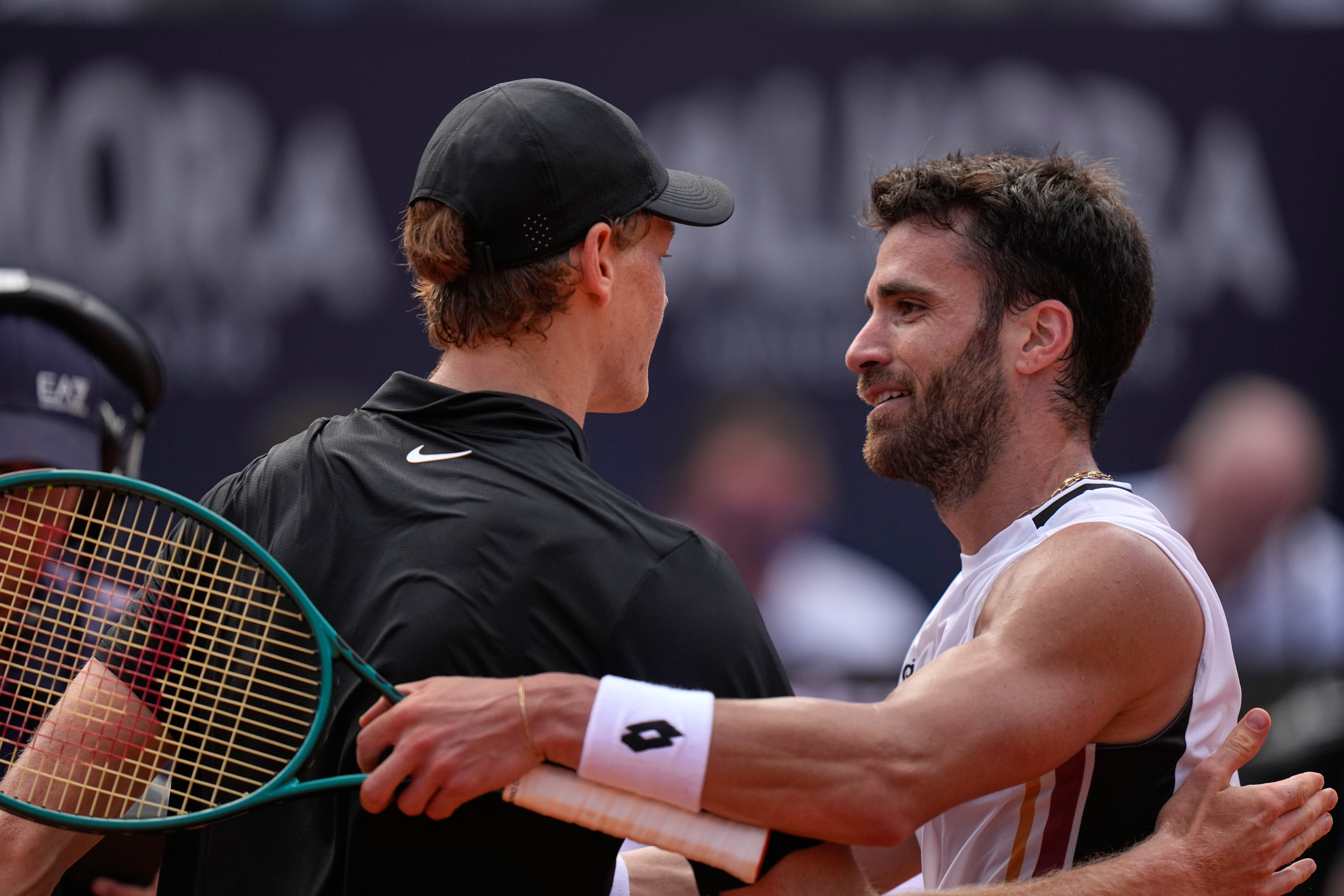 Italy's Jannik Sinner, left, greets Italy's Andrea Pellegrino after their match at the Italian Open tennis tournament in Rome, Tuesday, May 12, 2026. 