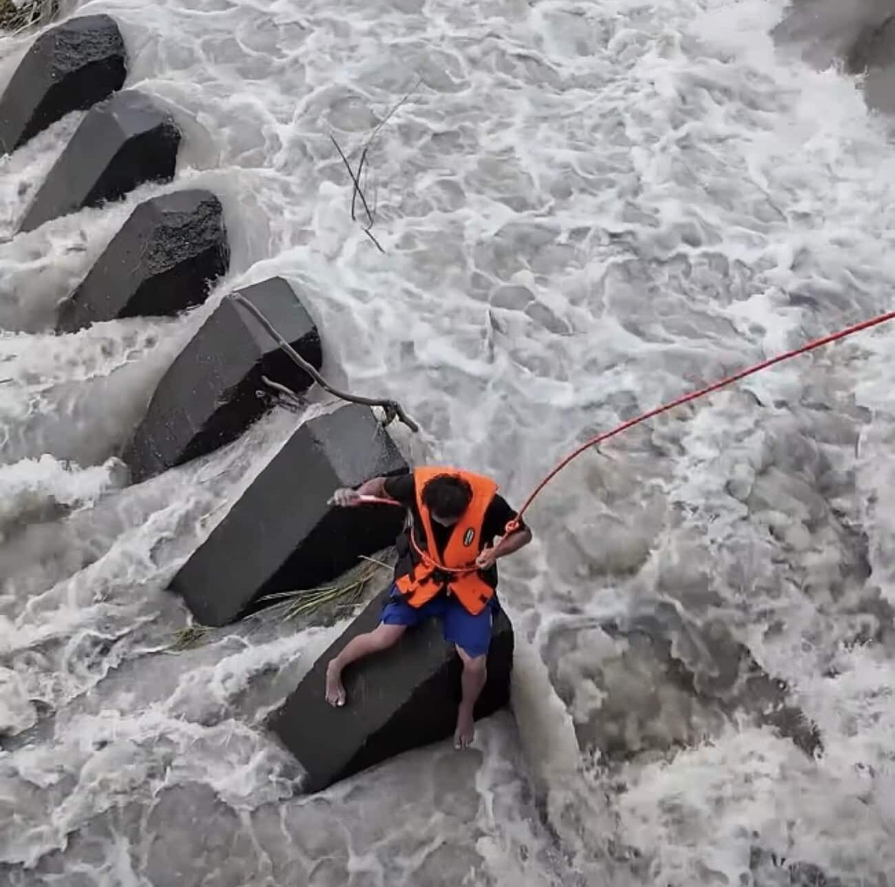 WATCH: Man rescued from swollen dam in Pampanga town amid heavy rains