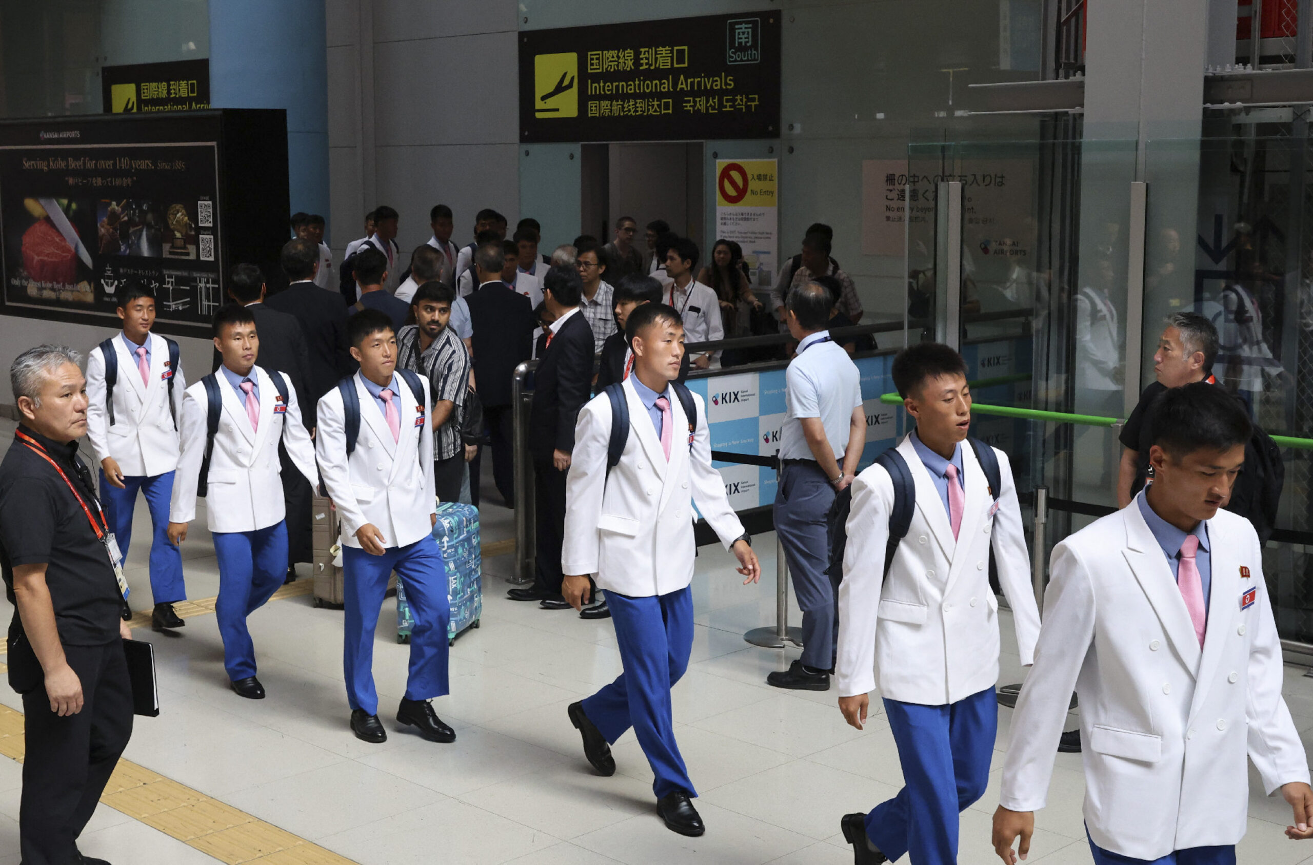 Members of the North Korean men's football team arrive at Kansai International Airport for the 2026 Asian Games, in Izumisano, Osaka prefecture on September 11, 2026. The Asian Games begin in Japan this week with Los Angeles Olympics qualifying spots up for grabs and athletes staying on a cruise ship in the middle of typhoon season.