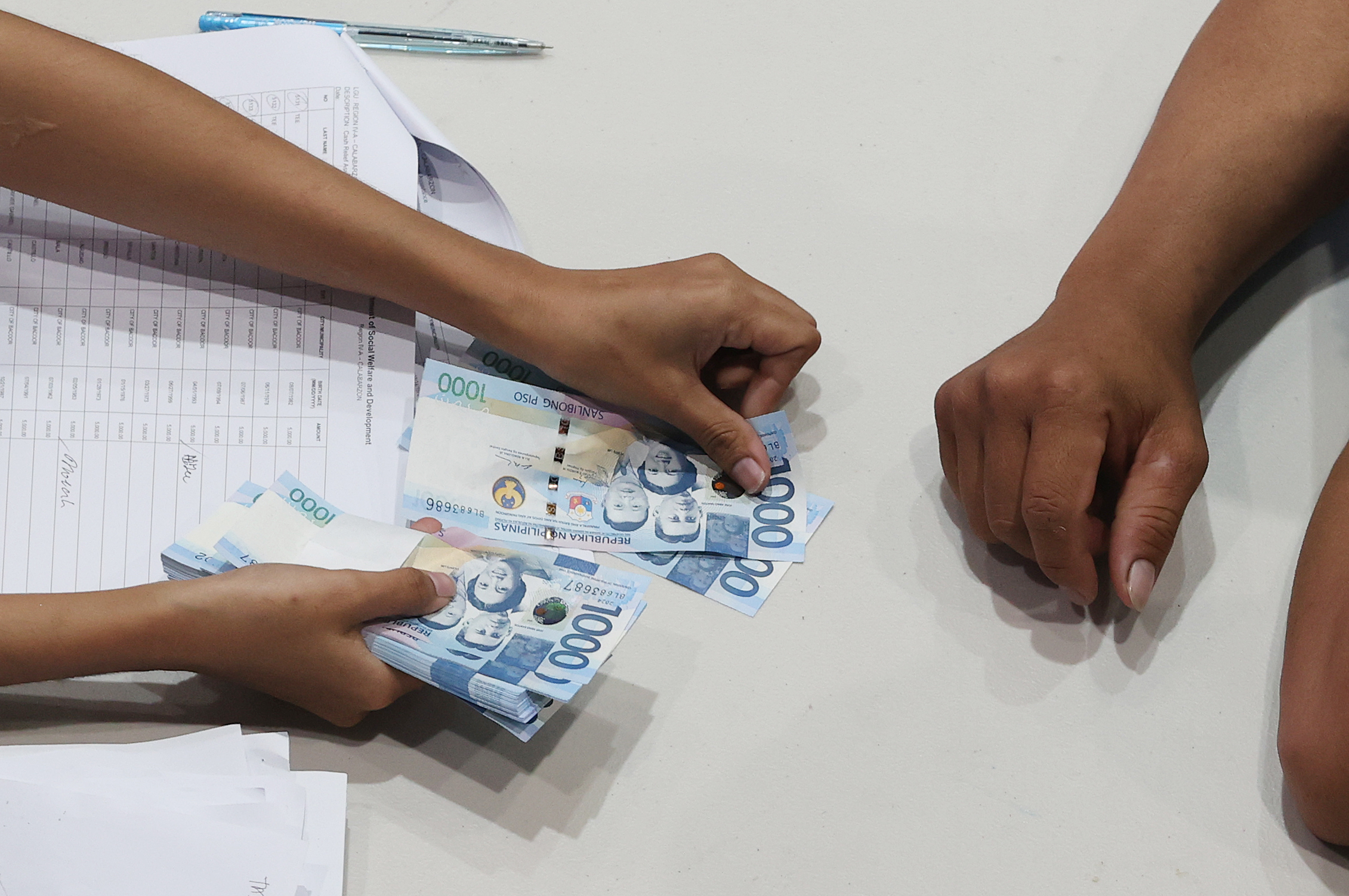 Motorcycle taxi rider dies while lining up for cash aid in QC