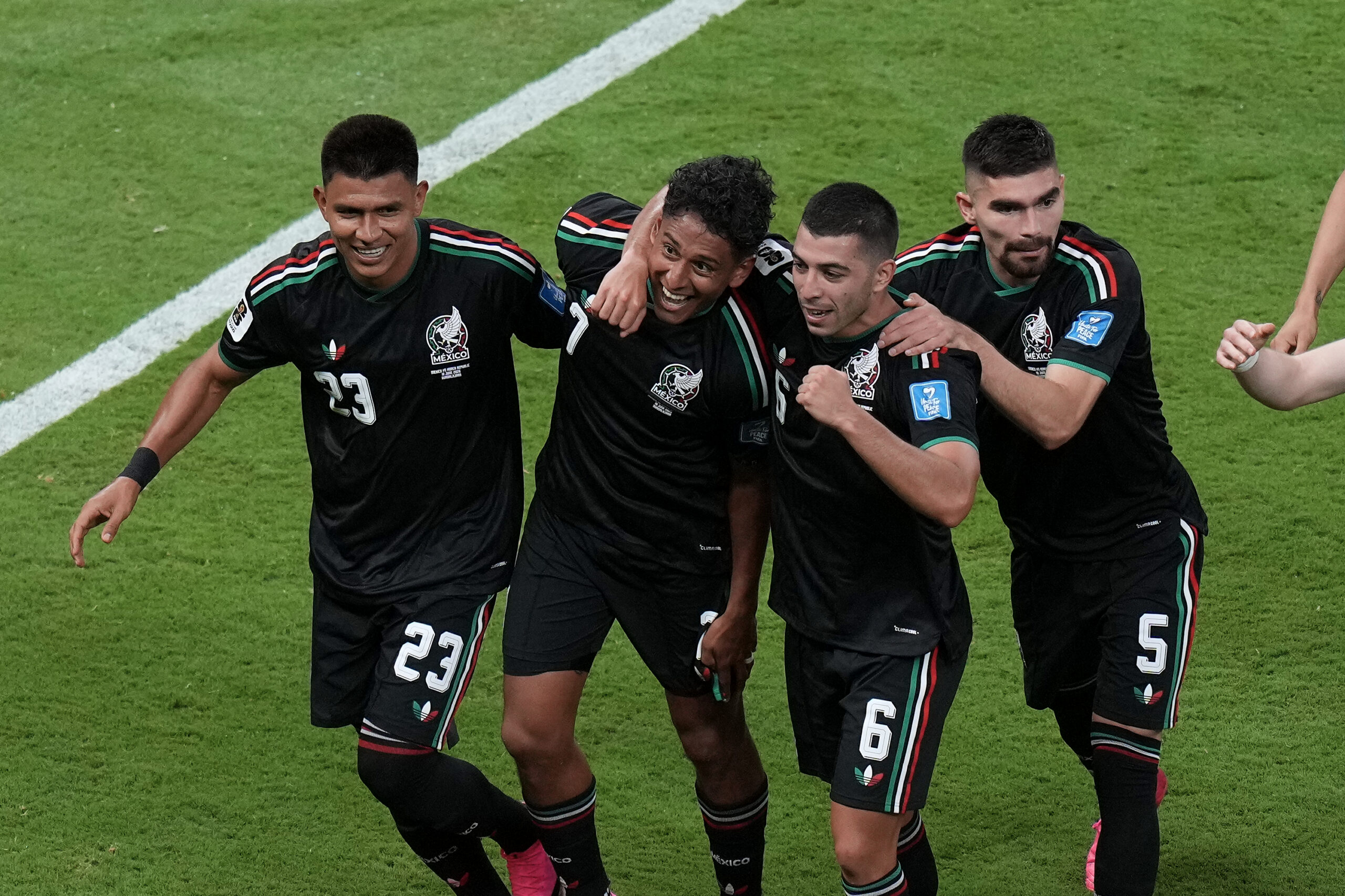Mexico's Luis Romo, second from left, celebrates with Jesus Gallardo (23), Erik Lira (6) and Johan Vasquez (5) after scoring the opening goal during the World Cup Group A soccer match between Mexico and South Korea in Zapopan, near Guadalajara, Mexico, Thursday, June 18, 2026