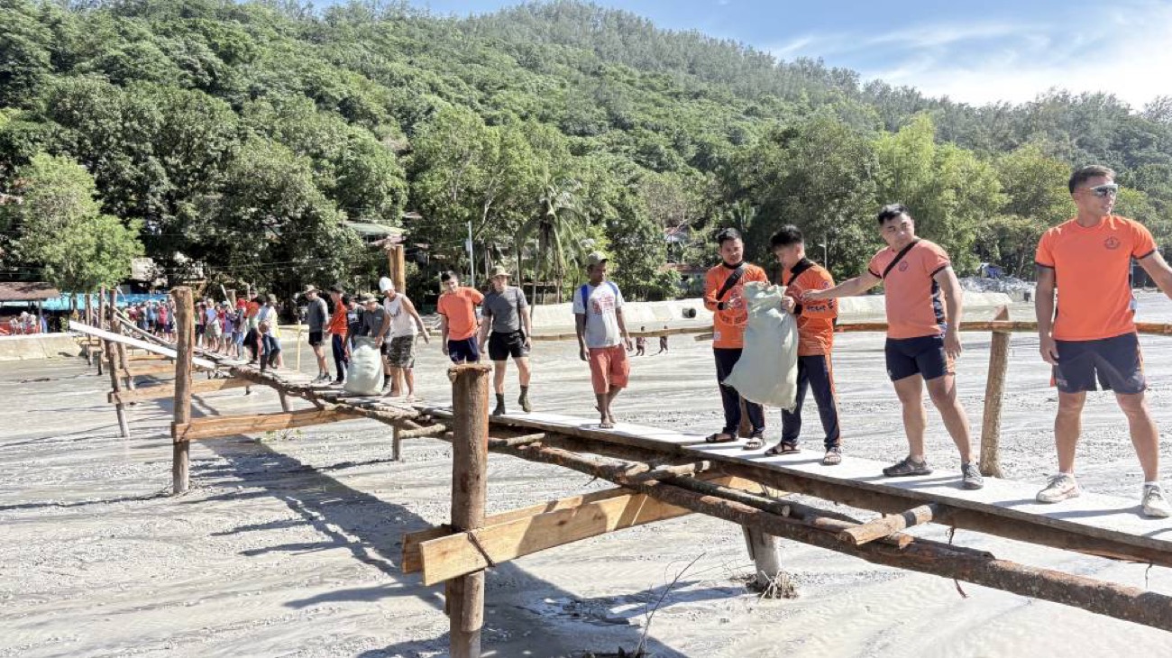 Isolated by flood, Zambales village builds its way back