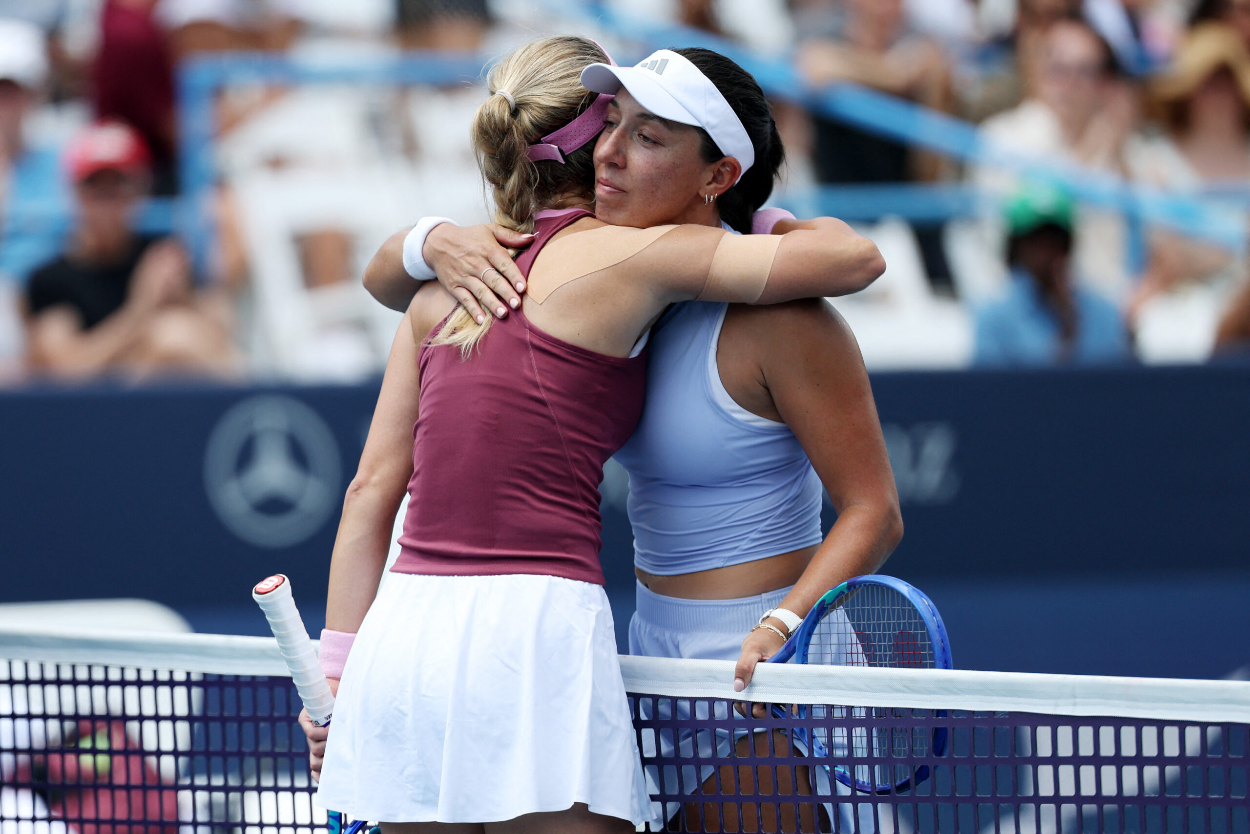 Jessica Pegula of the United States hugs Anna Kalinskaya after a women's singles match on day five of the Mubadala DC Open 2026 