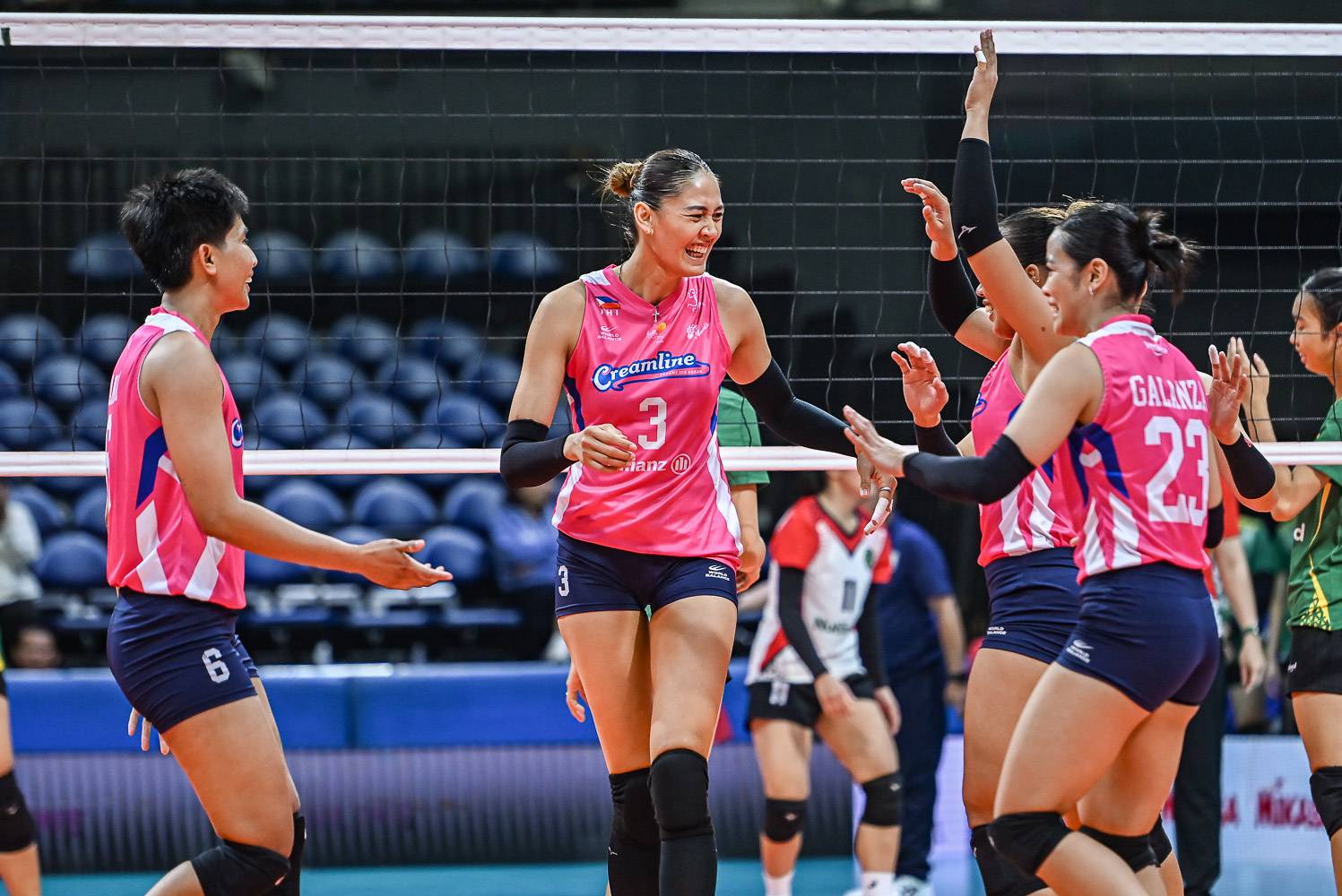 Jaja Santiago Minowa (left)celebrates with the rest of the
team.