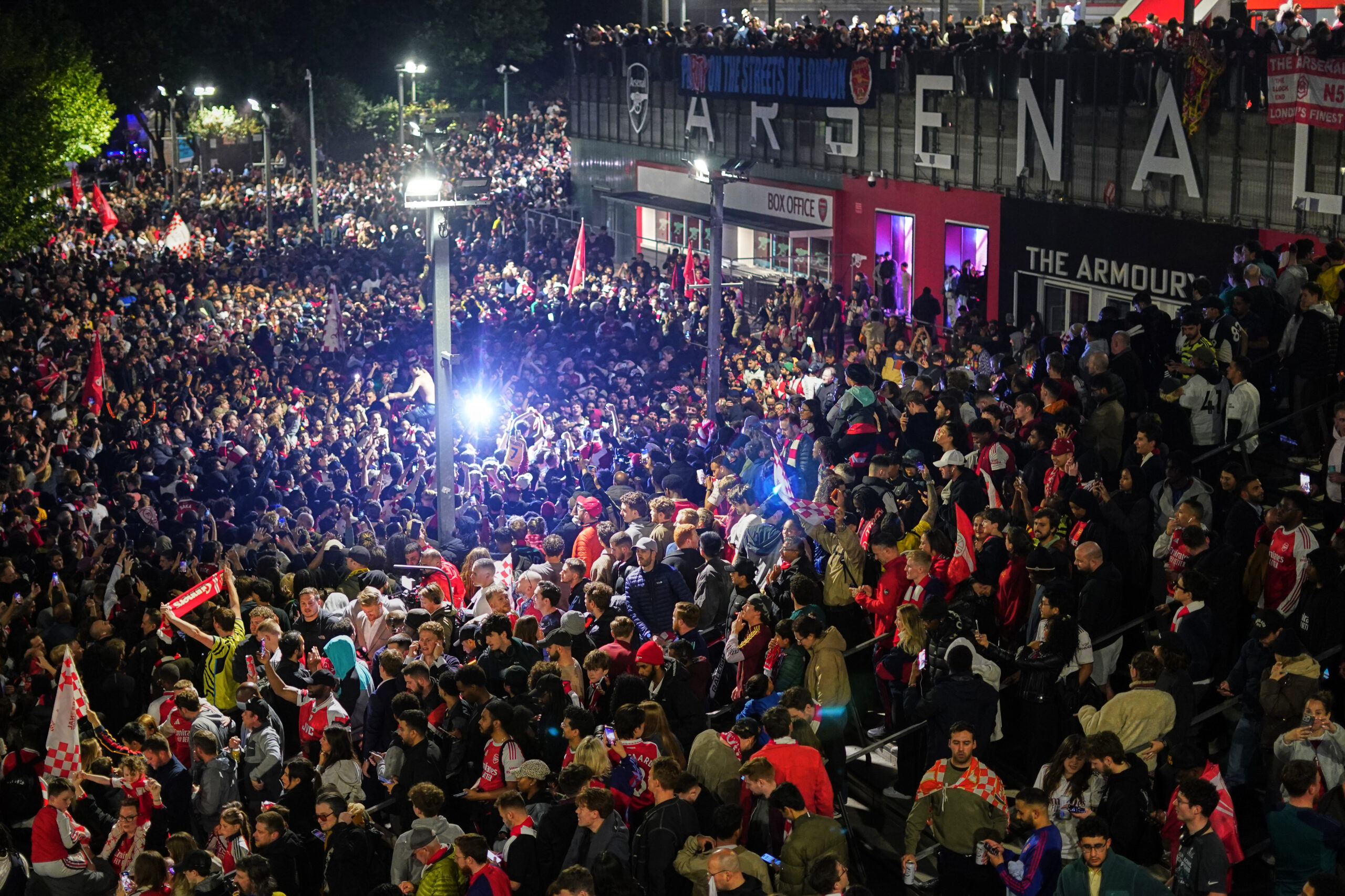 Arsenal supporters gather to celebrate at the Arsenal stadium after Arsenal's soccer team won the Premier League title in London, Tuesday, May 19, 2026.