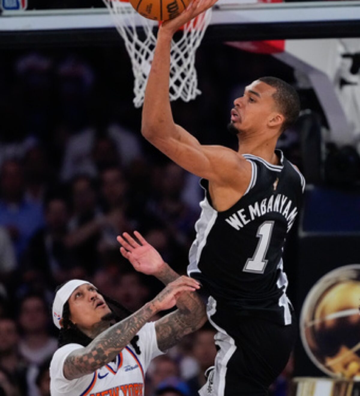 Spurs star Victor Wembanyama (1) rises to the basket against Knicks Fil-Am Jordan Clarkson.