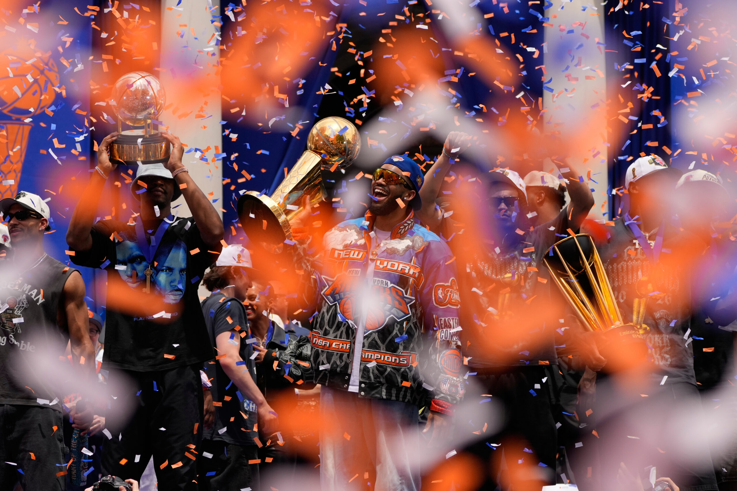 New York Knicks center Karl-Anthony Towns, center, celebrates with teammates during the New York Knicks' NBA championship parade Thursday, June 18, 2026, in New York.