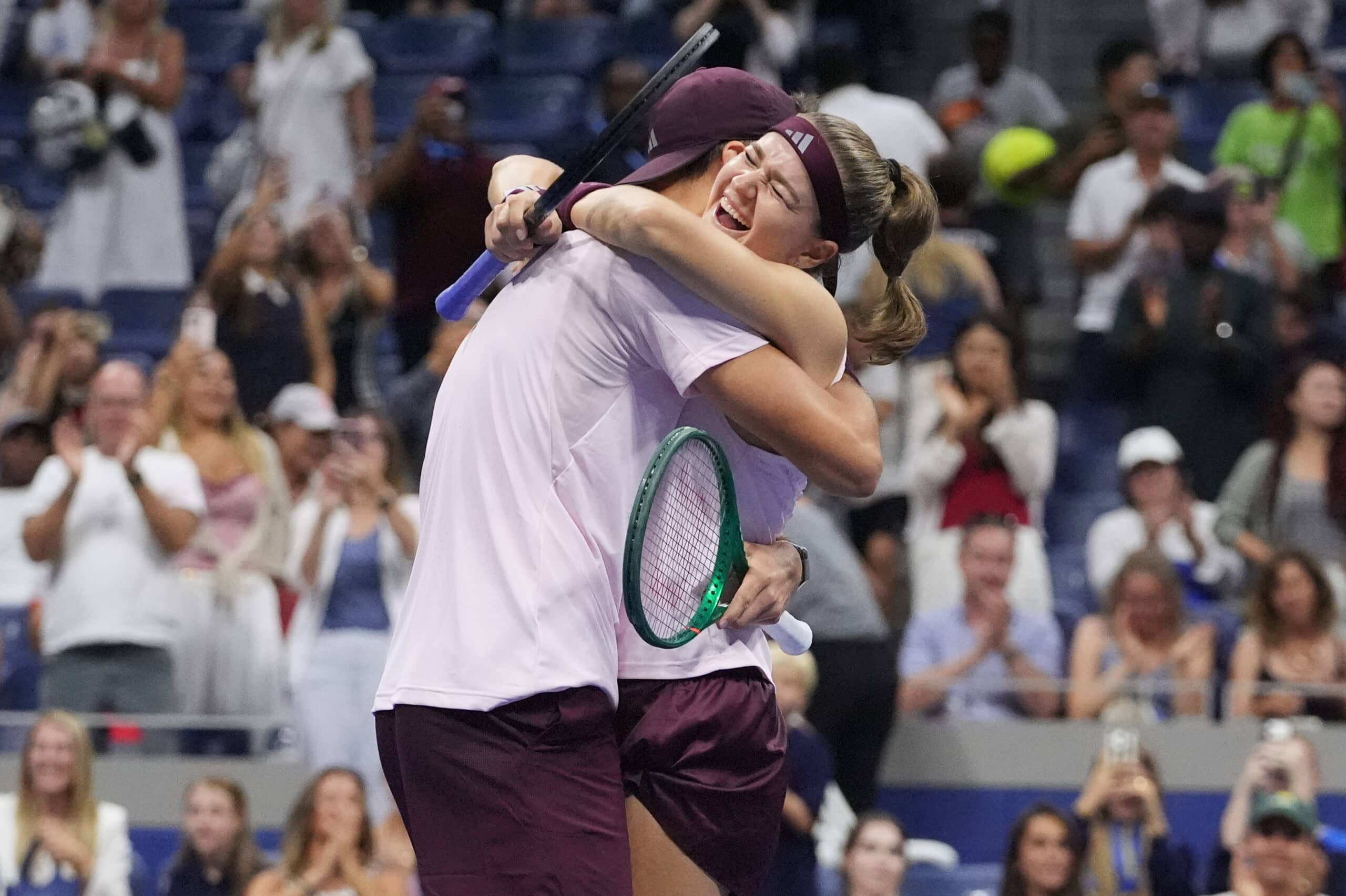 Jakub Mensik, of the Czech Republic, celebrates with Karolina Muchova, right, of the Czech Republic, after they won the mixed doubles final match against Belinda Bencic, of Switzerland, and Flavio Cobolli, of Italy, at the U.S. Open tennis championships Wednesday, Aug. 26, 2026, in New York.