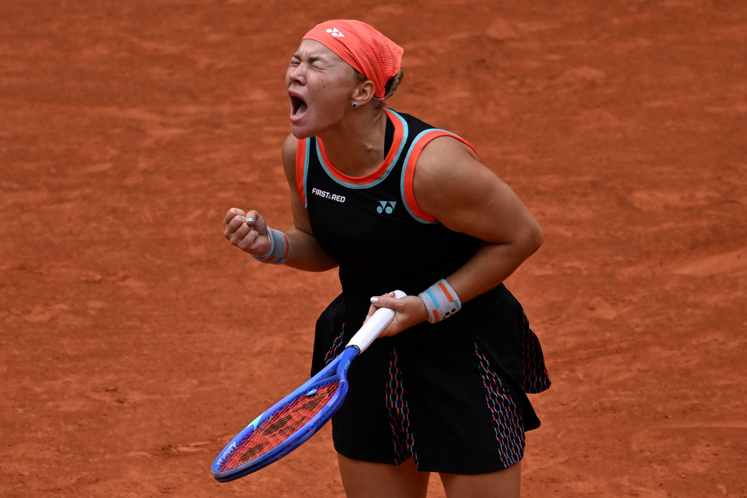 Russia's Diana Shnaider reacts after winning the quarterfinal tennis match against Aryna Sabalenka of Belarus at the French Open in Paris, Wednesday, June 3, 2026. 