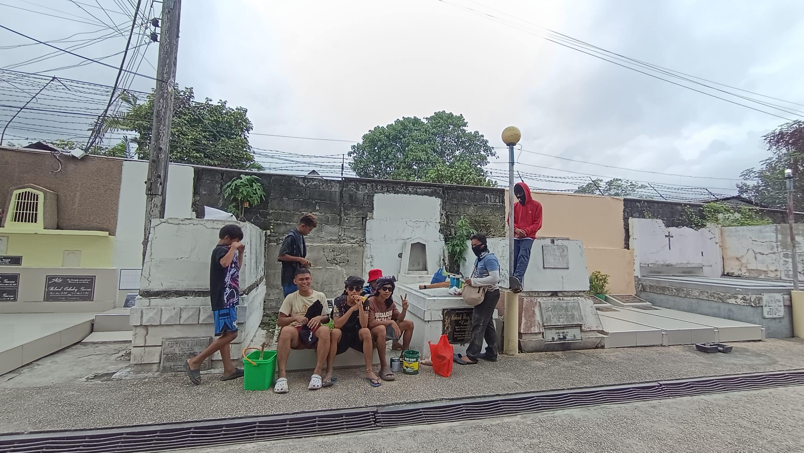 Undas brings seasonal work, extra income to Iligan City youth